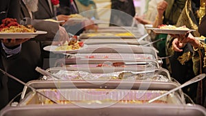 Catering buffet food in restaurant on traditional hindi wedding. Slow motion