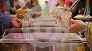 Catering buffet food in restaurant on traditional hindi wedding. Slow motion view