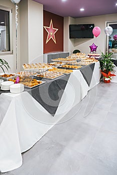 Catering buffet table with a delicious traditional Sicilian meal