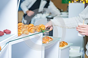 Catering buffet table with food and snacks for guests of the event. Group of people in all you can eat. Dining Food Celebration Pa