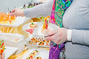 Catering buffet table with food and snacks for guests of the event. Group of people in all you can eat. Dining Food Celebration Pa