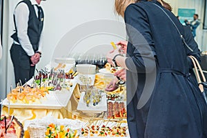 Catering buffet table with food and snacks for guests of the event. Group of people in all you can eat. Dining Food Celebration Pa