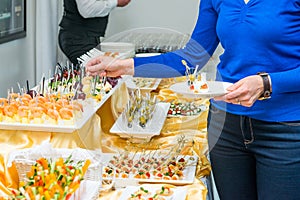 Catering buffet table with food and snacks for guests of the event. Group of people in all you can eat. Dining Food Celebration Pa
