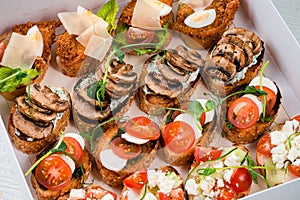 catering cardboard box with bruschetta