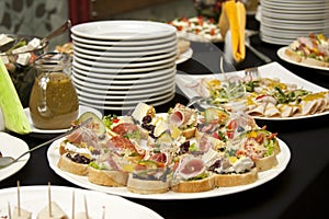 Catering, food service table, fresh tasty food on plates, smorgasbord