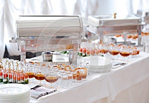 Catering food on table glasses and plates photo