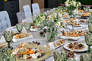 Catering Food Wedding Event Table, beautifully set table. Cheese, profiteroles, meat.