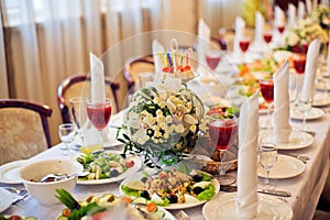 Catering service. Restaurant table with food. Huge amount of on the . Plates . Dinner time.