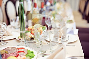 Catering service. Restaurant table with food. Huge amount of on the . Plates . Dinner time.