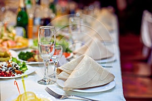 Catering service. Restaurant table with food. Huge amount of on the . Plates . Dinner time.
