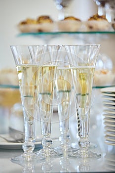 Catering services. Glasses with wine in row background at restaurant party.