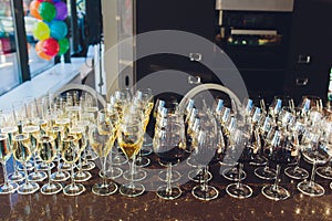 catering services. glasses with wine in row background at restaurant party.