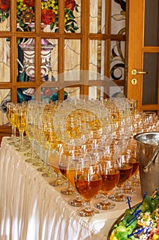 Catering services. glasses with wine in row background at restaurant party.