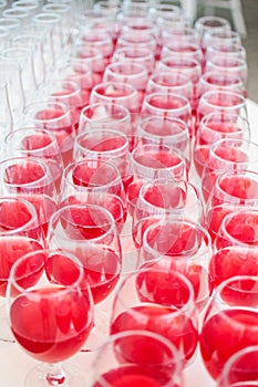 Catering services. glasses with wine in row background at restaurant party