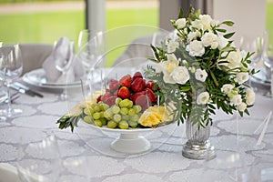 Catering wedding banquet table at reception. Restaurant presentation, food consumption, party concept. Fruit composition.