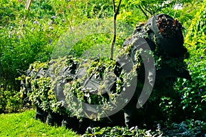 Caterpillar-shaped sculpture made of rubber and plants