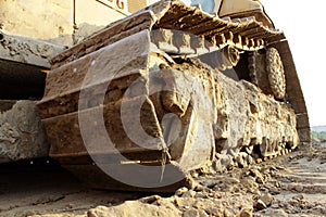 Caterpillar tractor bulldozer in the construction site during the of road junctions