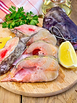 Catfish raw with lemon on board