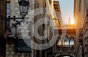 Cathedral of Barcelona in Las Ramblas at sunset and Famous Bridge of Sighs Pont del Bisbe photo