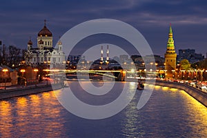 Cathedral of Christ the Saviour and towers of Moscow Kremlin on a background of Moskva river at night