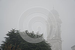Cathedral Church bell tower in fog, gothic style