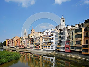 Cathedral and colorful houses on the side of river Onyar. Girona