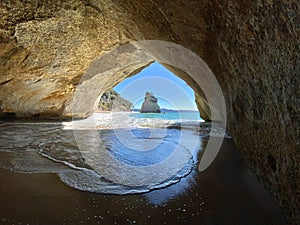 Cathedral cove, a hole in a rock on the peninsula Coromandel, New Zealand photo