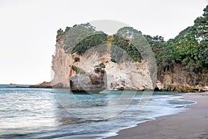 Cathedral Cove at sunset. It is a major attraction in Coromandel peninsula, New Zealand