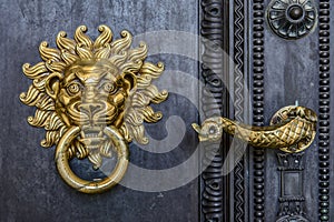 The cathedral door knocker and handle