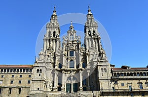 Cathedral, facade view from Praza do Obradoiro with blue sky. Santiago de Compostela, Galicia, Spain.
