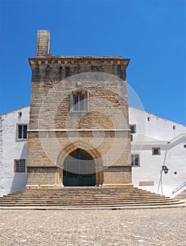 Cathedral of Faro or Se catedral de Faro with a bell tower at the Algarve coast of Portugal