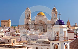 Cathedral of the Holy Cross on the Cadiz waterfront on a sunny day.