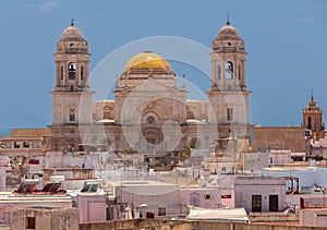 Cathedral of the Holy Cross on the Cadiz waterfront on a sunny day.