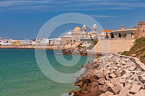 Cathedral of the Holy Cross on the waterfront of Cadiz on a sunny day.