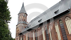 Cathedral of Koenigsberg on the Kneiphof island. Kaliningrad, Russia. Gothic tower with a clock. Side view