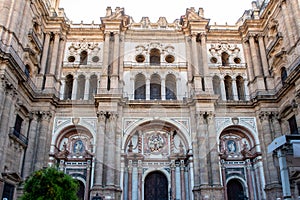 The Cathedral of Malaga front symmetrical view. Medieval Roman Catholic church in renaissance style with baroque facade, Spain.