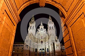 Cathedral at night from Town Hall arch, Palacio de Rajoy. Baroque facade and towers. Santiago de Compostela, Spain.