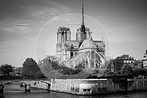 Cathedral of Notre Dame de Paris sunny autumn afternoon. Embankment of the Seine. The natives and tourists take a walk and relax photo