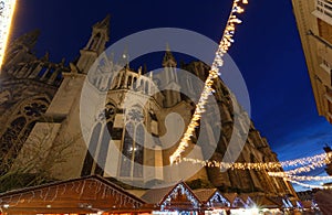 Cathedral of Notre Dame, Reims and Christmas market stalls in the night. One of the most stunning masterpieces of 13th