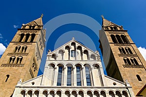 Cathedral part elevation and stone facade with columns and arches in neo Romanesque style