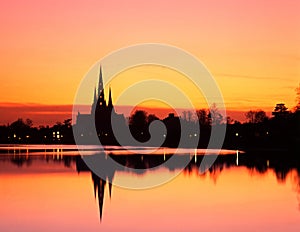 Cathedral and pool at sunset, Lichfield, England.