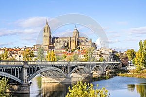 Cathedral of Salamanca and bridge over Tormes river, Spain photo