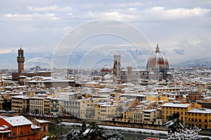 Cathedral Santa Maria del Fiore Duomo and giottos bell tower campanile, in winter with snow Florence, Tuscany photo