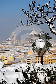 Cathedral Santa Maria del Fiore Duomo and giottos bell tower campanile, in winter with snow Florence, Tuscany photo