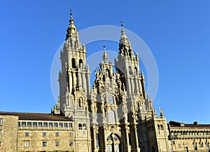 Cathedral, Santiago de Compostela, Obradoiro Square, Spain. Baroque facade and towers, side view with sunset light. Sunny day. photo