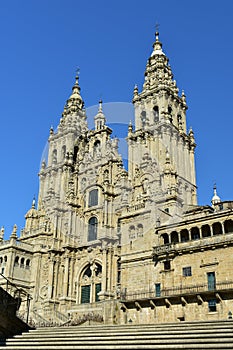 Cathedral: Side view from stairs. Santiago de Compostela, Obradoiro Square. Spain. Sunny day, clean stone, blue sky.