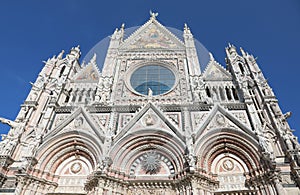 Facade of Cathedral of Siena in Tuscany Region in Italy photo