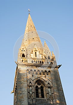 A cathedral spire in late afternoon
