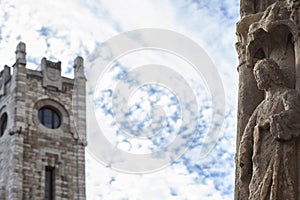 Cathedral Statue and Correos building tower at Regla Square, Leon, Spain photo