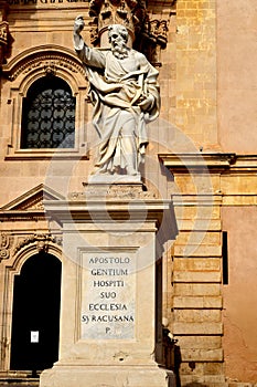 Cathedral of Syracuse, detailed view: apostol in the forefront and Corinthian columns in the background-Ortigia,Sicily, Italy